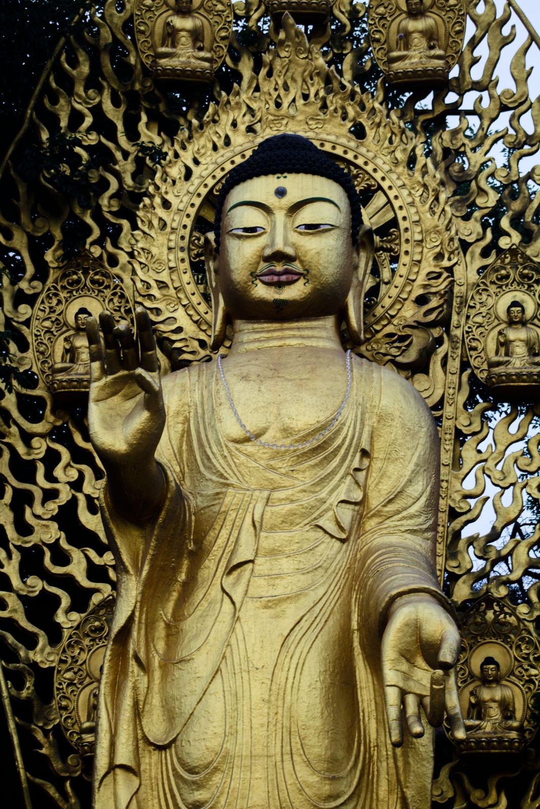 A gilded standing Buddha